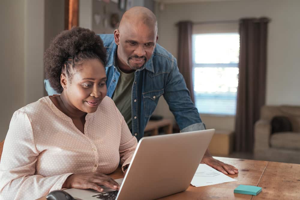 smiling couple on computer