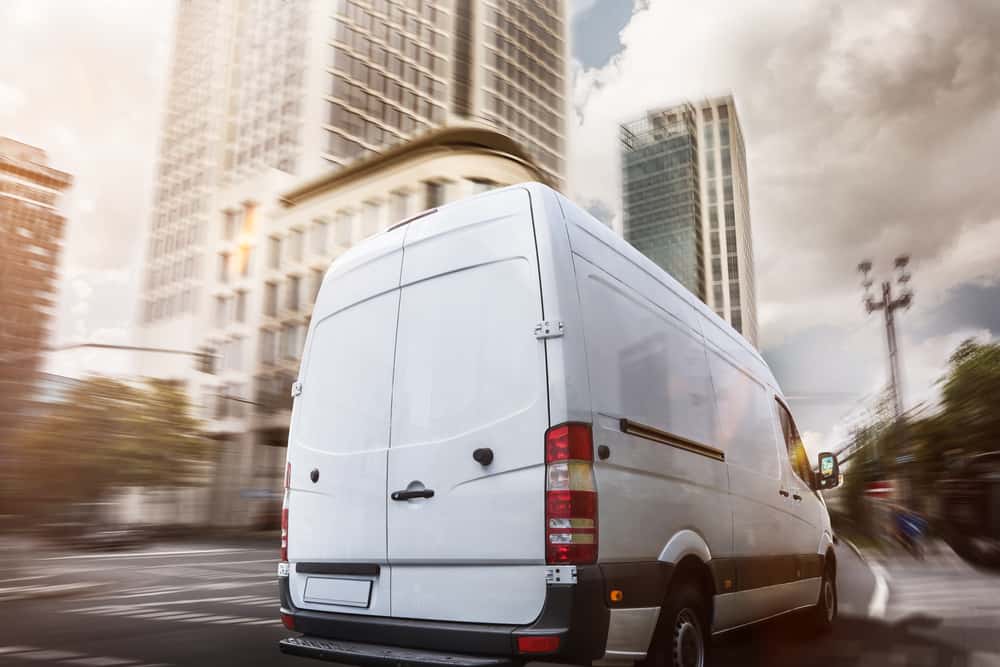 commercial van driving on road