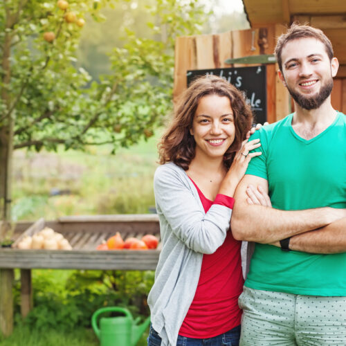 Young couple with home out in the country