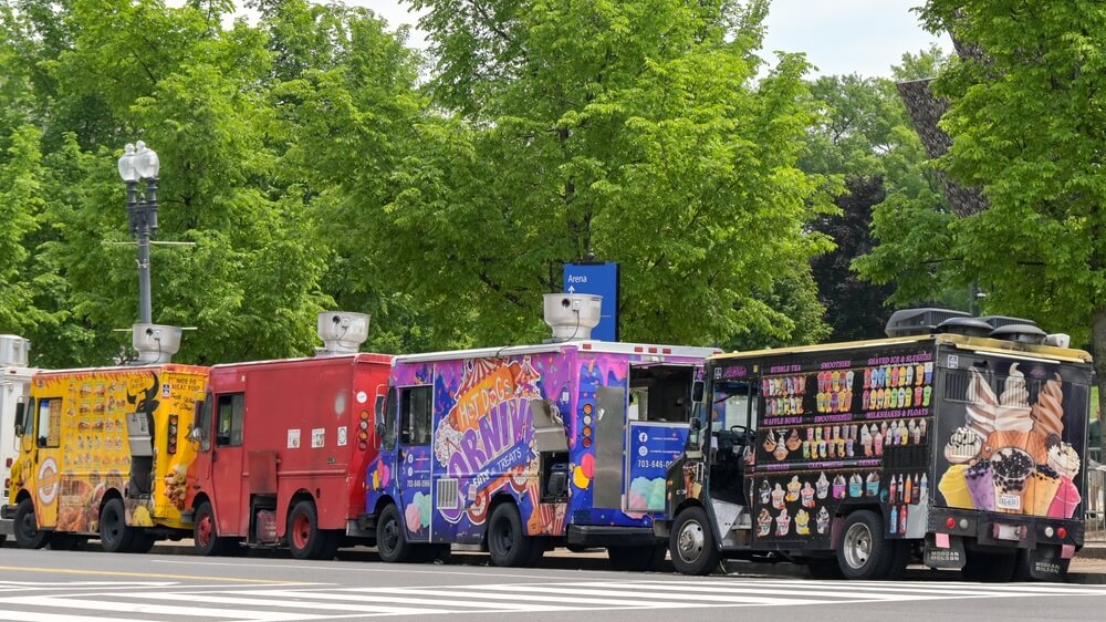 Row of fast food and ice cream trucks parked on one of the main roads in Washington DC