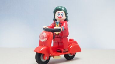 Mini toy of the Jocker driving a red motorcycle with blurred background - Vern Fonk, cheap homeowners insurance in Pacific Northwest