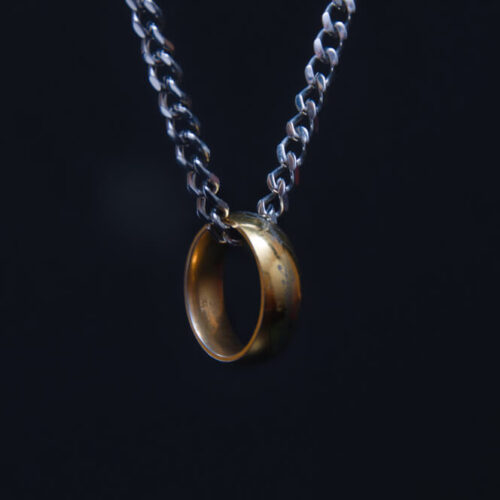 A gold ring on a silver chain