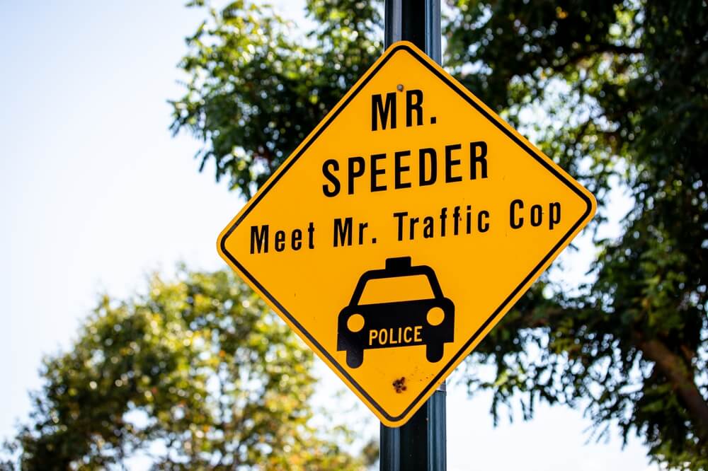 A traffic sign warning speeders they will get a ticket - cheap car insurance in Washington.